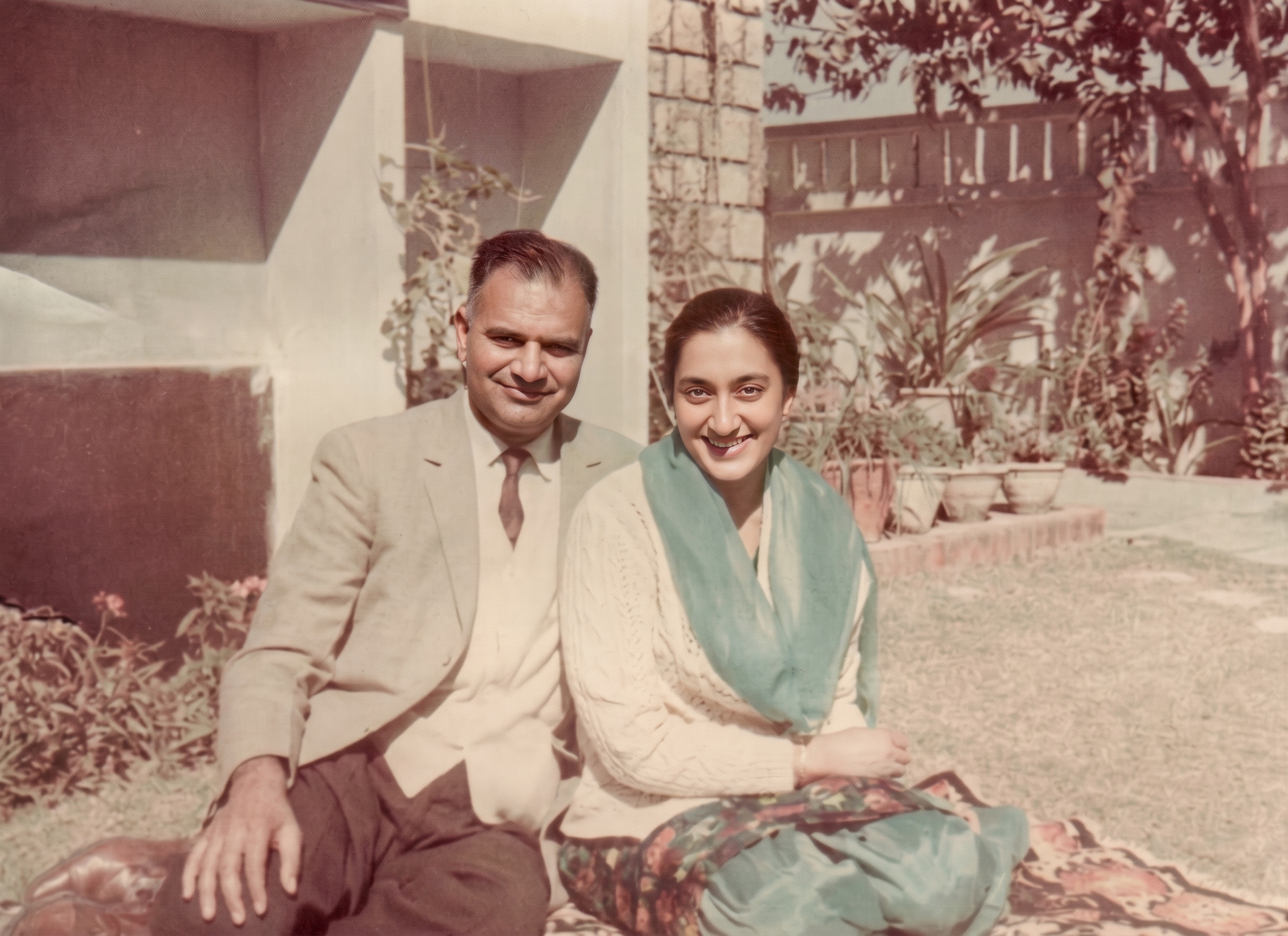 Mashkoor Chishti, left, and Rani seated outdoors in Lahore